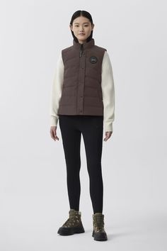 An updated silhouette to our classic Freestyle Vest. This exceptional, down-filled vest is the ultimate layering piece that can be worn across all seasons. A classic, and versatile vest that is a well-insulated layer Outerwear Vest, Black Label, Layering Pieces, Outerwear Women, Canada Goose, All Seasons, Duvet, Layering, Grey