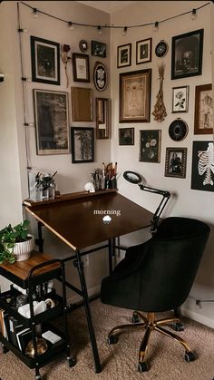 a room with pictures on the wall and a desk in front of a computer chair