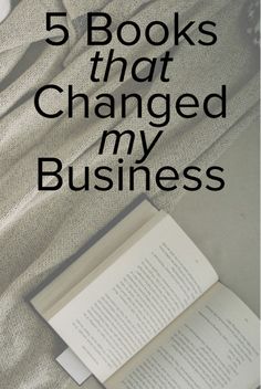 an open book sitting on top of a bed with the title 5 books that changed my business