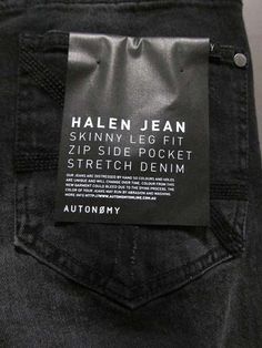 a label on the back pocket of a pair of jeans that are not in use