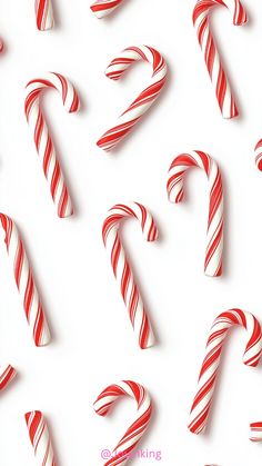 many candy canes are lined up in the shape of numbers on a white background