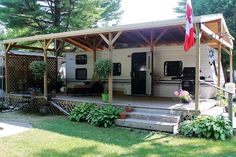 a mobile home with a covered porch and patio