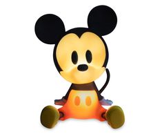 a mickey mouse lamp sitting on top of a white surface