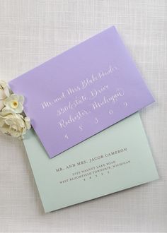 the wedding stationery was done in lavender and mint green, with calligraphy on the envelope