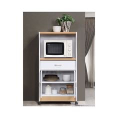 a microwave oven sitting on top of a wooden shelf next to a potted plant