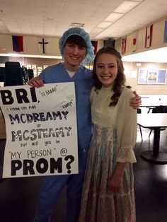 a man and woman standing next to each other holding a sign that says bri, mcdreamy or mystery will you prom prom?