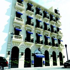 a large white building with balconies and windows