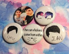 four badges with cats and the caption'cat whiskers come from within '