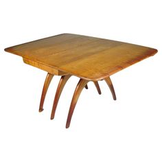 a wooden table with two legs and a square top on it's side, against a white background