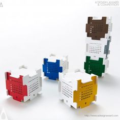 four different colored lego blocks with numbers on the front and back, all stacked together