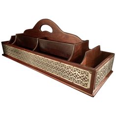 a wooden tray with three compartments on it