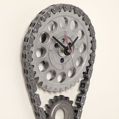 a clock made out of gears on the wall