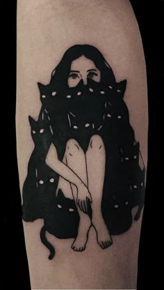 a black and white photo of a woman with cats on her leg, done by tattoo artist