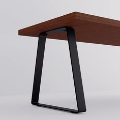 a wooden table with black metal legs