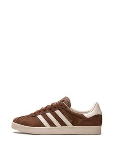 Find ADIDAS Gazelle 3-stripes Leather Sneakers on Editorialist. coffee brown/cream white calf leather panelled design contrast stitching signature 3-Stripes logo signature trefoil logo detail appliqué lettering logo-embossed tongue branded heel counter round toe front lace-up fastening branded insole flat rubber sole Gazelle Adidas, Matching Fits, Harness Fashion, Sneakers Brown, Brown Sneakers, Coffee Brown, Adidas Gazelle, Panel Design, Cream White