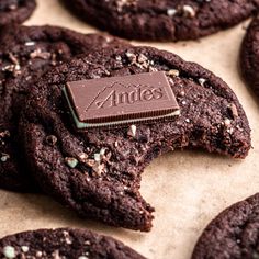 chocolate cookies with white sprinkles and an adhesive sticker on top