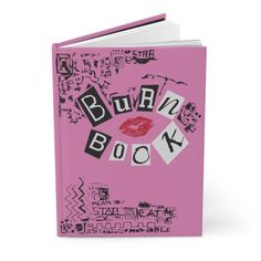 a pink book with black and white writing on the front cover that says burn book