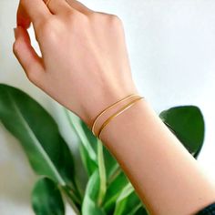 Layered Herringbone Bracelet | Gold Snake Chain Bracelet | Minimalist Bracelet for Her | Two Layer Bracelet ⚫️ BLACK FRIDAY SALE - 50% OFF! ⚫️ ✨LIMITED STOCK REMAINING✨ We pride ourselves on unique and personal designs that not only look elegant but also tell a story. Our jewellery is designed to last a lifetime just like the memories they create ♡ Introducing our Layered Herringbone Bracelet : ♡ C O L O U R: Gold ♡ M A T E R I A L: Plated gold ♡ S I Z E: Adjustable to most wrist sizes 📦 S H I Serpent Bracelet, Herringbone Bracelet, Gold Snake Chain, Bracelet For Her, Bracelet Minimalist, Snake Chain Bracelets, Minimalist Bracelet, Gold Snake, Bracelet Black