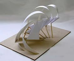 an abstract sculpture made out of white paper