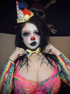 a woman with makeup and clown make up on her face