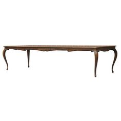 an old wooden table with two legs and a long, curved top on white background