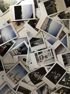 many polaroid pictures are arranged together on the wall