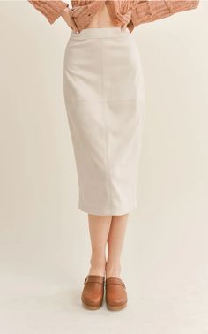 Our Gallery Midi Skirt is in a faux suede and has front topstitching details. Back Zip Closure 90% POLYESTER 10% SPANDEX LE3635 Fitted Suede Skirt For Fall, Fitted Beige Midi Skirt, Cream Fitted Midi Skirt, Beige Cotton Midi Skirt, Fall Fitted Suede Skirt, Fall Beige Midi-length Skirt, Suede Midi Skirt, Non-stretch Beige Midi Skirt, Midi Sweater Skirt