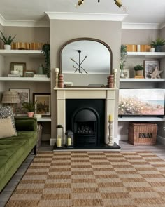 a living room filled with furniture and a fire place