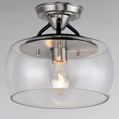 a light fixture with a clear glass bowl