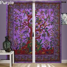 a purple wall hanging with a tree and flowers on it