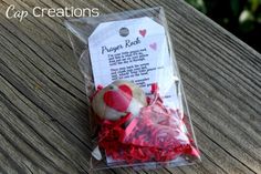 a package of red and white hearts sitting on top of a wooden table