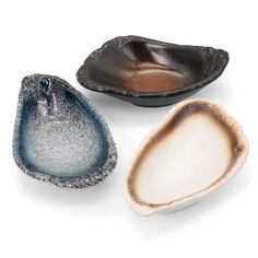 three different shaped bowls sitting next to each other