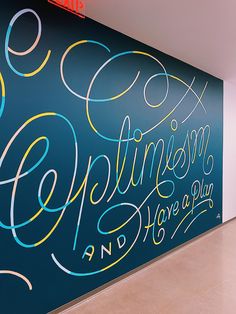 the wall is painted with colorful lettering on it