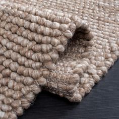 a close up view of a rug on the floor with some sort of textured material