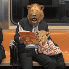 a lion is sitting on a bench reading to a little boy who is wearing a suit and tie