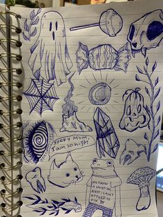 an open notebook with drawings on it