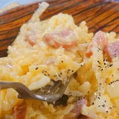 pasta with ham, cheese and black pepper sprinkled on top