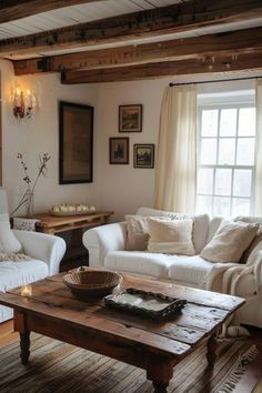 a living room filled with furniture and a wooden coffee table