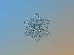 a snowflake is shown in the middle of a blue and gray background,