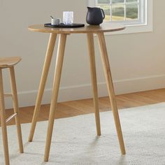 a small table with two stools next to it