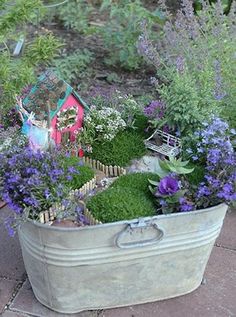 a bucket filled with lots of different types of plants