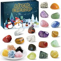 an assortment of colorful rocks and crystals in front of a box with the words, adventure calendar on it