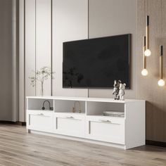 a white entertainment center with two drawers and a flat screen tv mounted on the wall