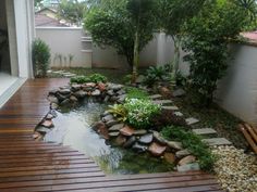 a small pond in the middle of a wooden deck