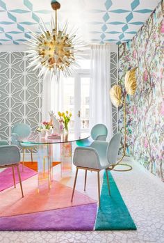 an instagram photo of a dining room with colorful rugs and wallpaper on the walls