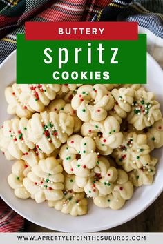 buttery spritz cookies on a white plate