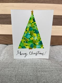 a card with a christmas tree on it