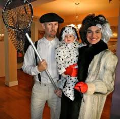 a man, woman and child dressed up in costumes