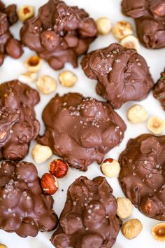 chocolate cookies with nuts and sea salt on a white plate, ready to be eaten