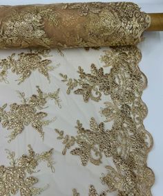 Champagne Floral Lace by the Yard,  Gold Floral Embroidery on Mesh Lace Fabric, Bridal Lace for Wedding Dress Tablecloth Runners Costumes Applique, Champagne Gold Embroidered Lace with Sequins. The flowers are embroidered with sequins on a mesh lace fabric. This lace is hand-beaded with sequins and has double scallops along the width, giving off a sophisticated and elegant look. Corded Lace: The lace has thicker threads around the embroidery, making the patterns stand out with a raised, 3D effect. It is soft and fluid to the touch. This lace can be used for dresses, tablecloths, nightgowns, skirts, prom dresses, wedding dresses, table runners, decorations, and much more. Edge: Scalloped on both edges Primary fiber: Polyester Primary fabric: Lace Color: Champagne Vibrant color. Width: 54 in Corded Lace, Color Champagne, For Wedding Dress, Gold Sequins, Floral Bridal, 3d Effect, Gold Floral, Bridal Lace, Champagne Gold